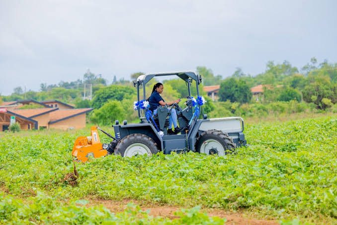 A tractor working a field in Uganda